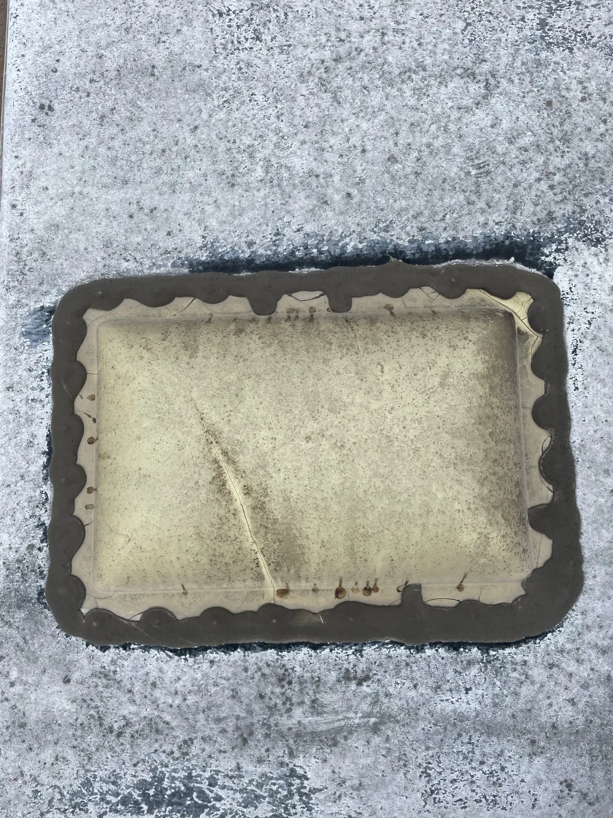 Cracked, dirty RV skylight with failed old sealant around the flange