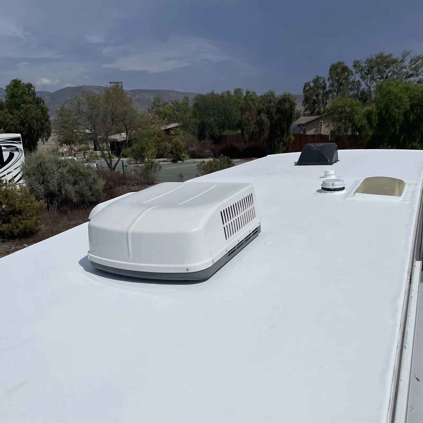 Same travel trailer after new white TPO roof